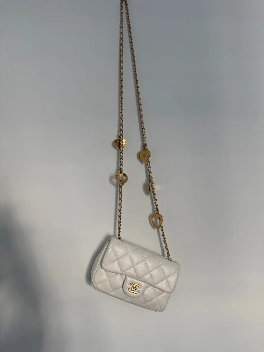 CHANEL White Quilted Mini Flap Bag with Gold Chain and CC Turn-Lock